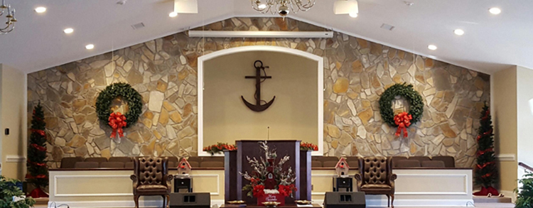 The platform and stone accent wall inside the auditorium
